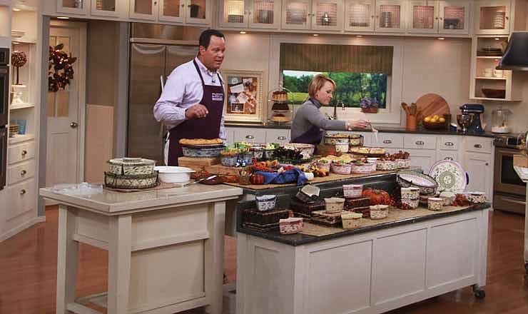 This undated publicity photo provided by QVC, shows QVC program host David Venable and Tara McConnell on set from Temp-tations during one of QVC's "In the Kitchen with David Â®" broadcasts.
