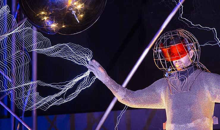 Magician David Blaine stands inside an apparatus surrounded by a million volts of electric currents streamed by tesla coils during his 72-hour "Electrified: 1 Million Volts Always On" stunt on Pier 54, Friday, Oct. 5, 2012, in New York.