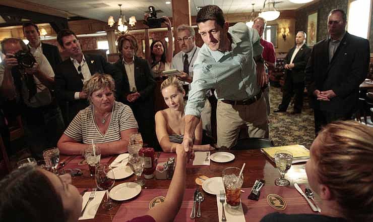 In this Aug. 25, 2012, file photo, Republican vice presidential candidate, Rep. Paul Ryan, R-Wis., speaks to diners at Puritan Backroom restaurant in Manchester, N.H.