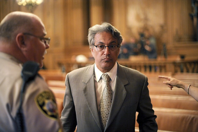 Suspended San Francisco Sheriff Ross Mirkarimi arrives at a Board of Supervisors meeting Tuesday in San Francisco. The supervisors voted Tuesday against removing the sheriff from office after a domestic violence incident between Mirkarimi and his wife, Eliana Lopez.