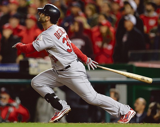 The Cardinals' Daniel Descalso watches his solo home run in the eighth inning of Game 5 of the National League division series against the Nationals on Friday in Washington.