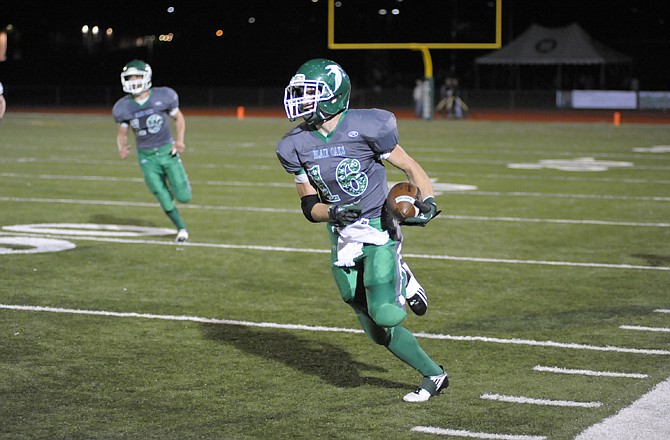 Blair Oaks' Tyler Clutts runs in the open field against Versailles on Friday at the Falcon Athletic Complex.