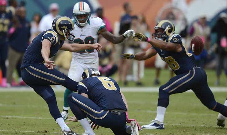 St. Louis Rams kicker Greg Zuerlein (4) attempts a 66-yard field goal which would have tied the game in the fourth quarter of an NFL football game against the Miami Dolphins, Sunday, Oct. 14, 2012, in Miami. Zuerlein missed the field goal and the Dolphins defeated the Rams 17-14. At right is tight end Lance Kendricks (88).