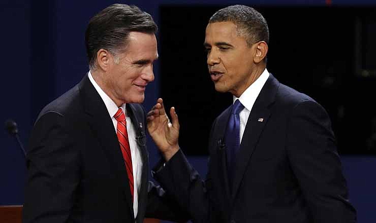 In this Oct. 3, 2012 file photo, Republican presidential candidate, former Massachusetts Gov. Mitt Romney and President Barack Obama talk after the first presidential debate in Denver. The two men meet for their second debate tonight.