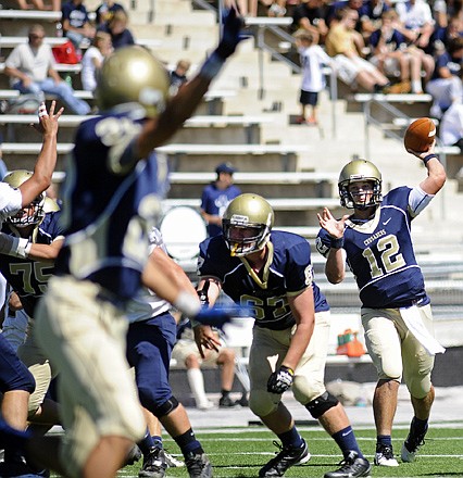 Helias quarterback Wyatt Porter fires a pass downfield during a game against Quincy (Ill.) Notre Dame earlier this season at Adkins Stadium.