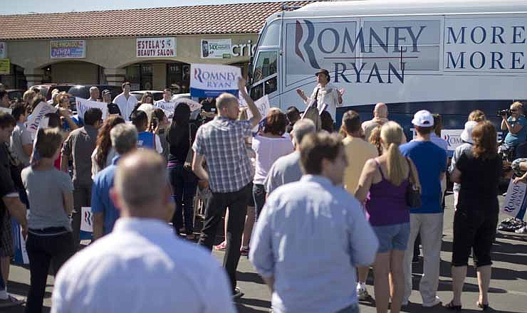 Comedian Paul Rodriguez speaks to a crowd of Mitt Romney supporters outside a Romney campaign office in, Saturday, Oct. 20, 2012, in Las Vegas. Romney officials argue that Hispanics, who suffer from a 9.9 percent unemployment rate, more than 2 points higher than the national rate, are naturally drawn to the GOP ticket. But some Romney supporters are pessimistic that Republicans can make inroads with a population that, many polls show, favors Obama by a 2-1 margin. 