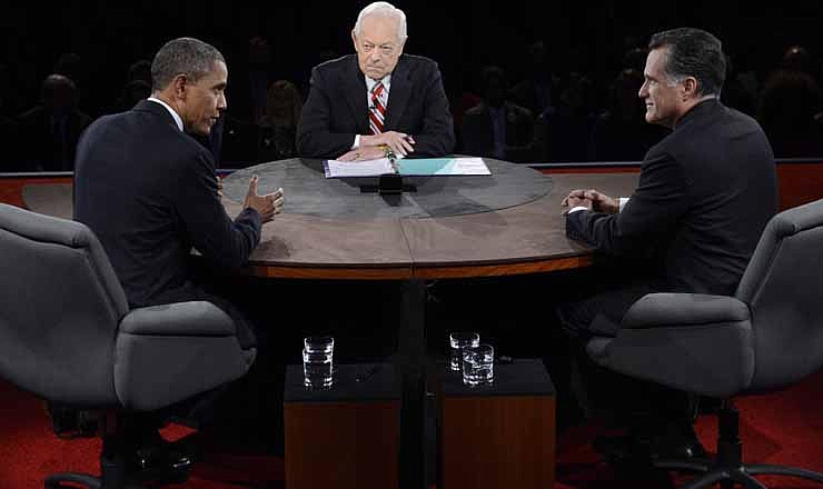 President Barack Obama speaks as Republican presidential nominee Mitt Romney and moderator Bob Schieffer listen during the third presidential debate at Lynn University, Monday, Oct. 22, 2012, in Boca Raton, Fla.