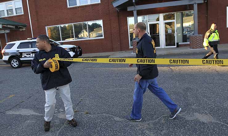 Federal agents investigate the offices of New England Compounding Center in Framingham, Mass., Tuesday, Oct. 16, 2012. The company's steroid medication has been linked to a deadly meningitis outbreak. 