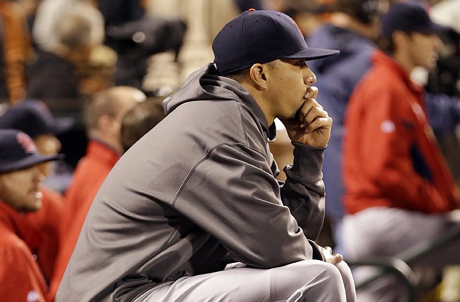 Cardinals starting pitcher Kyle Lohse sits on the bench during the sixth inning of Monday night's game against the Giants in San Francisco.