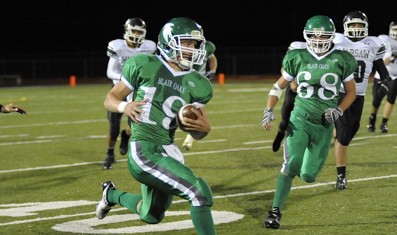 Blair Oaks quarterback Daniel Castillo rushes for yardage during a game earlier this season against Warsaw at the Falcon Athletic Complex. Castillo may be out for the season after suffering a foot injury in practice Monday.