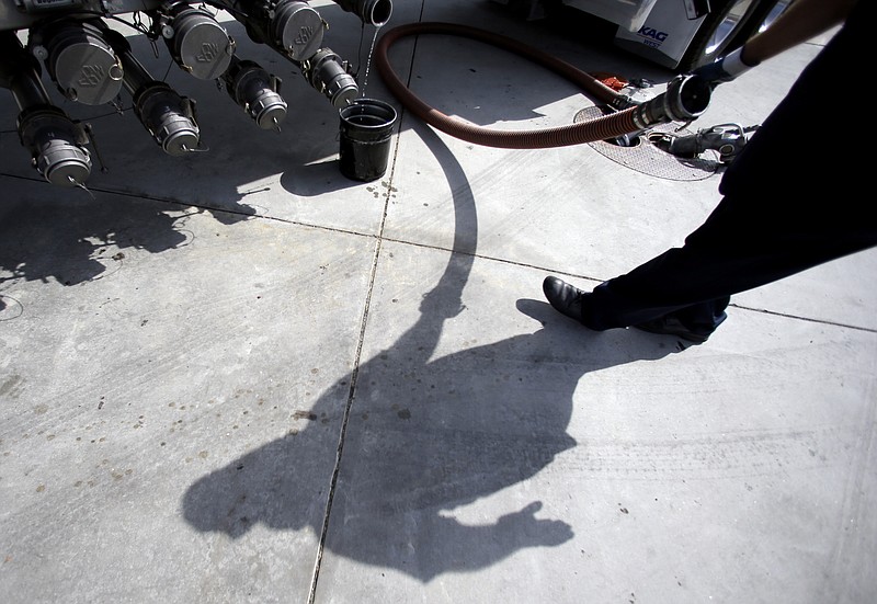 A gas truck delivery driver fills the tanks at a gas station in Garden Grove, Calif. Gasoline across the U.S. is cheaper Wednesday, after a week of rapid price declines. The national average for a gallon of gas has dropped 13 cents in the past week to $3.625. That's the biggest weekly decline since the 7-day period ended Nov. 28, 2008, according to Oil Price Information Services analyst Fred Rozell.