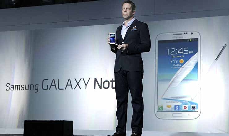 Kevin Packingham, chief product officer for Samsung Mobile USA, demonstrates the new Samsung Galaxy Note II during a launch event, Wednesday, Oct. 24, 2012, in New York. Aside from the 5.5 inch screen, the Note comes with a stylus and runs the latest version of Google's Android operating system, Jelly Bean.