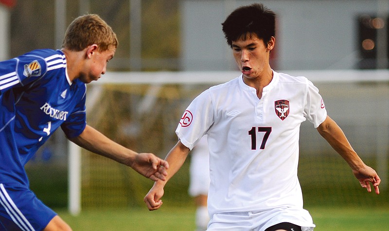 Jefferson City's Mason Vonderhaar (right) steps in to take possession of the ball off the foot of Rockhurst's Kyle McLagan in the second half of Wednesday's matchup at the 179 Soccer Park.