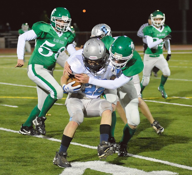 Blair Oaks' Chance Cumpton makes a tackle on Tolton/Calvary's Will Tindal on Thursday night at the Falcon Athletic Complex.