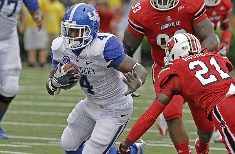 Kentucky's Raymond Sanders (4), shown carrying the ball against Louisville earlier this season, is the Wildcats' leading rusher this season.