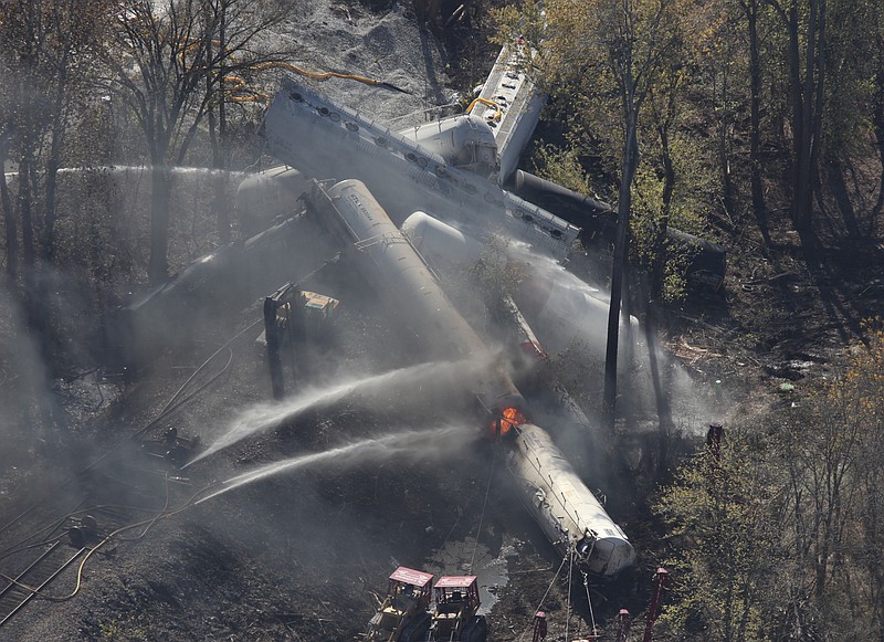 Flames can be seen from the air after an explosion happened Wednesday at the sight of a train derailment in southern Jefferson County, just south of Louisville, Ky.