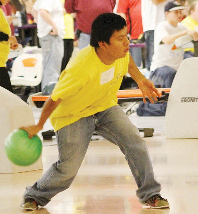 Thomas Swenson, a graduate of Fulton High School, prepares his shot Saturday during Special Olympics competition at the Fulton Bowling Center.