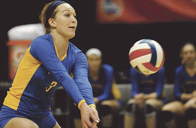 Fatima middle hitter JoAnna Muenks gets a dig in the first set of the Lady Comets' 25-14, 25-19 win against the St. Pius X Lancers in the Class 2 championship match in Cape Girardeau. 