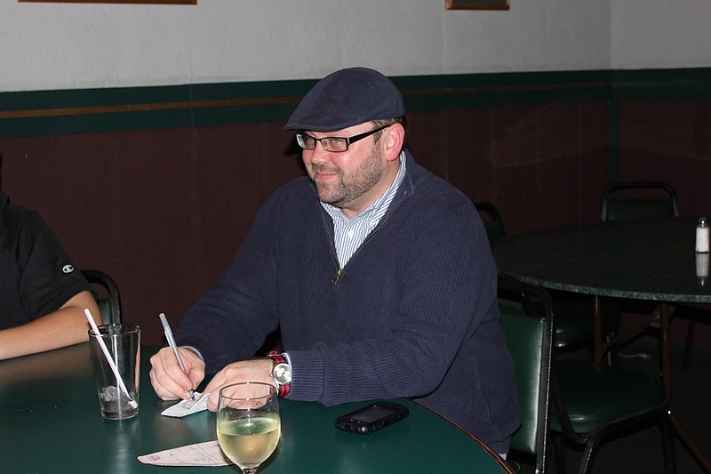 Jody Paschal smiles as he tallies the final votes during his election party at Sir Winston's. Paschal defeated incumbent Dan Roe for the position of Callaway County Assessor.