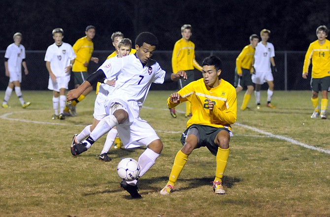 Jefferson City's Marcus Woodruff tries to make a move on Rock Bridge's Jordan Reiske during Tuesday night's game at the 179 Soccer Park.