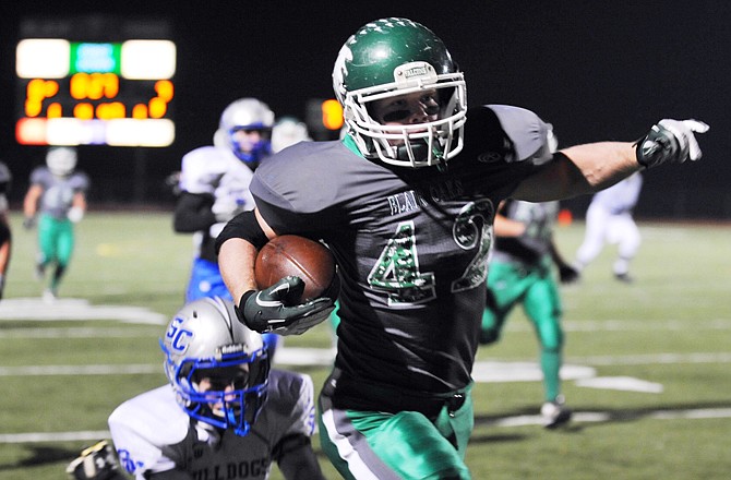 Derek Otto of Blair Oaks heads toward the end zone during Monday night's Class 2 District 6 game against Blair Oaks at the Falcon Athletic Complex.