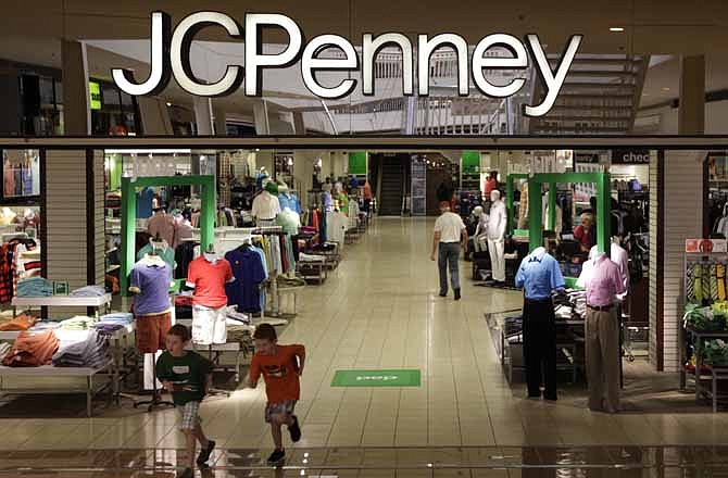 In this Tuesday, June 19, 2012 file photo, shoppers walk in a J.C. Penney story in Plano, Texas.