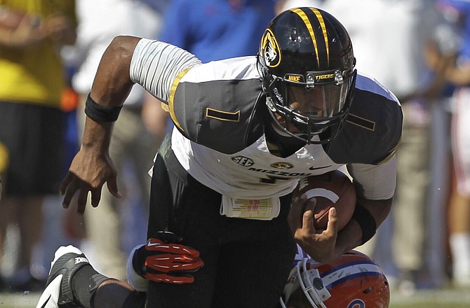 Missouri quarterback James Franklin is sacked by Florida defensive lineman Jonathan Bullard during last Saturday's game in Gainesville, Fla.