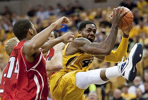 Missouri's Alex Oriakhi, right, pulls down a rebound in front of Southern Illinois-Edwardsville's Derian Shaffer, left, during the first half of an NCAA college basketball game on Saturday, Nov. 10, 2012, in Columbia, Mo. 