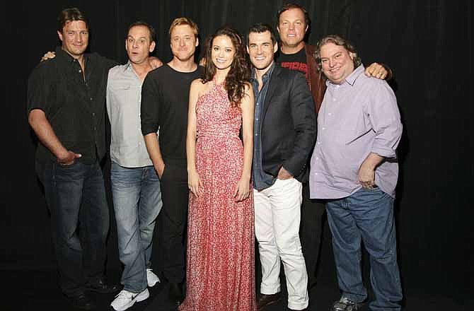 This July 2012 publicity photo provided by the Science Channel shows the cast of "Firefly," from left, Nathan Fillion, executive producer Tim Minear, Alan Tudyk, Summer Glau, Sean Maher, Adam Baldwin and executive story editor Jose Molina, reuniting for the 10 year anniversary of the series in the Science Channel Special, "Firefly: Browncoats Unite," airing on Sunday, Nov. 11, 2012 at 10PM ET/PT.