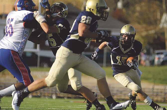 Helias running back Garrett Buschjost looks for running room during Saturday's Class 4 quarterfinal game at Adkins Stadium. Helias defeated Clayton 31-8.