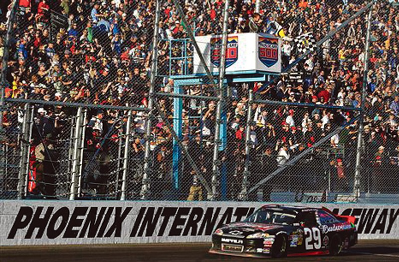 Kevin Harvick (29) takes the checkered flag during the Sprint Cup AdvoCare 500 on Sunday at Phoenix International Raceway.