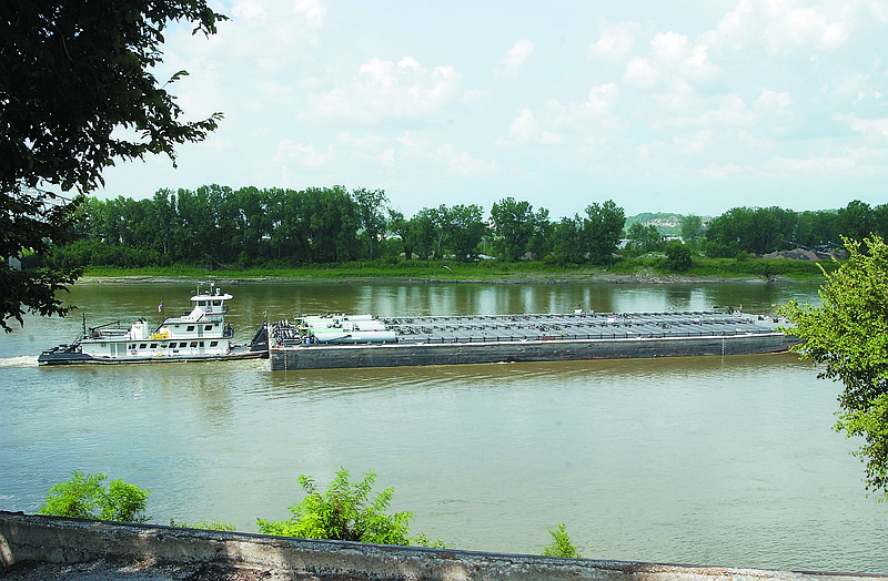 A barge makes its way down the Missouri River past Jefferson City.
