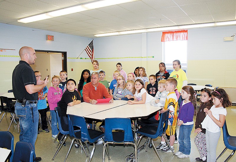 City of California Mayor Norris Gerhart, seated center, signed a proclamation Friday at California Elementary School declaring Nov. 12-16 American Education Week.