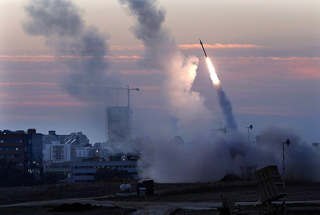 The Iron Dome defense system fires to intercept incoming missiles Thursday from Gaza in the port town of Ashdod. Israel's prime minister Benjamin Netanyahu said Thursday the army is prepared for a "significant widening" of its operation in the Gaza Strip. 