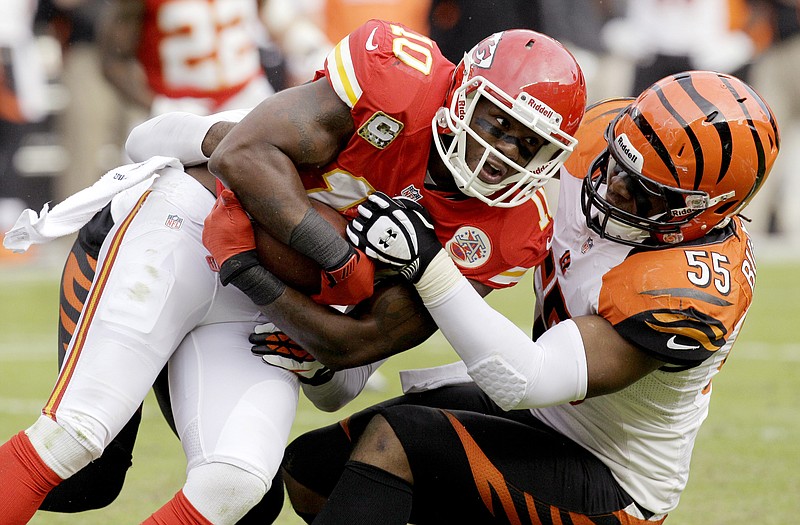 Bengals outside linebacker Vontaze Burfict (55) tackles Chiefs wide receiver Terrance Copper during the first half Sunday in Kansas City.