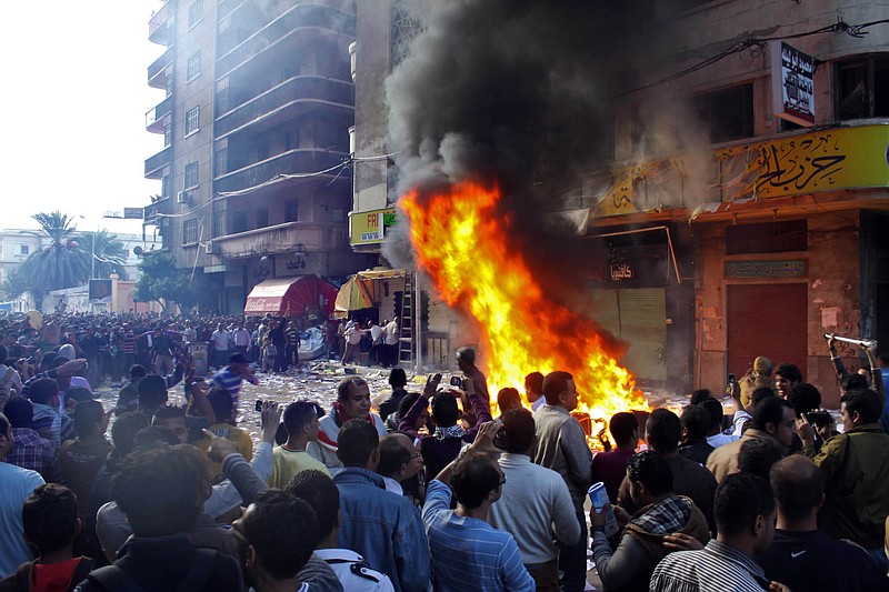 Protesters storm an office of Egyptian President Mohammed Morsi's Muslim Brotherhood Freedom and Justice party and set fires Friday in the Mediterranean port city of Alexandria, Egypt. State TV says Morsi opponents also set fire to his party's offices in the Suez Canal cities of Suez, Port Said and Ismailia.