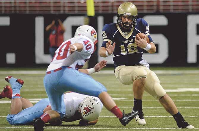 Helias quarterback Wyatt Porter tries to find running room after scrambling out of the pocket in the first quarter of Saturday's Class 4 state championship game against Webb City at the Edward Jones Dome in St. Louis. 