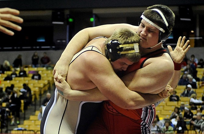 John Carter of Jefferson City (right) faces James Broderick of Oakville in the opening round of last season's Class 4 state tournament at Mizzou Arena. Carter returns to the starting lineup for the Jays at 285 pounds.