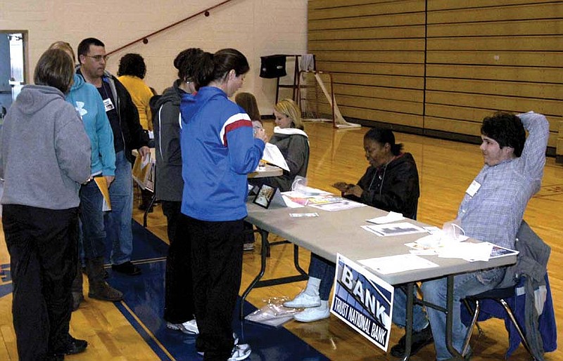 Lining up at the bank during the poverty simulation at California High School.  