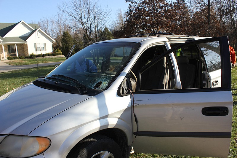 Fulton emergency responders investigated an accident Wednesday where a foreign object apparently fell off a vehicle and broke through this minivan's windshield off of Wood Street, seriously injuring the driver. The female victim was transported by helicopter to the hospital.