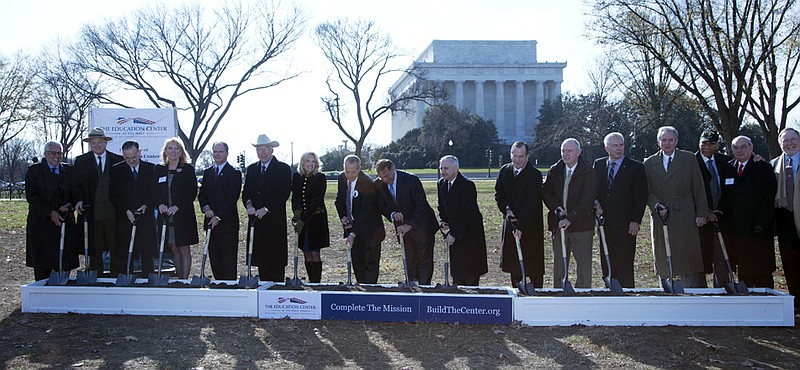 Defense Secretary Leon Panetta and Jill Biden, wife of Vice President Joe Biden, along with congressional leaders, veterans and Gold Star family members, line up Wednesday during a ground-breaking ceremony for the Education Center at The Wall near the Lincoln Memorial in Washington. 