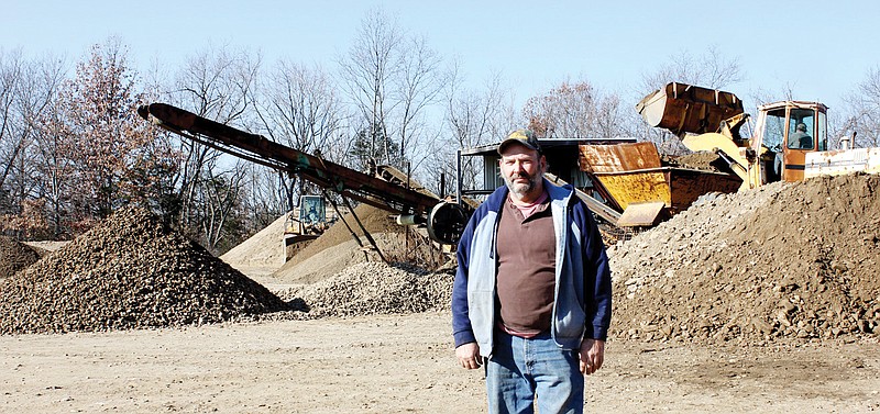 John Klick, who owns John Klick Trucking, operates a gravel screening and storage plant on County Road 403 in Callaway County. Klick says the county could save money by buying more creek gravel from him instead of limestone quarry rock spread on county roads.