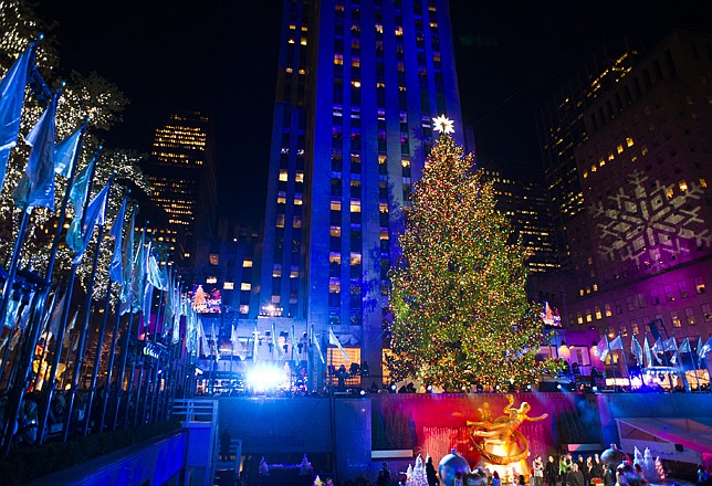 The 80-foot-tall Rockefeller Center Christmas tree is lighted using 45,000 energy efficient LED lights during the 80th annual lighting ceremony on Wednesday in New York.