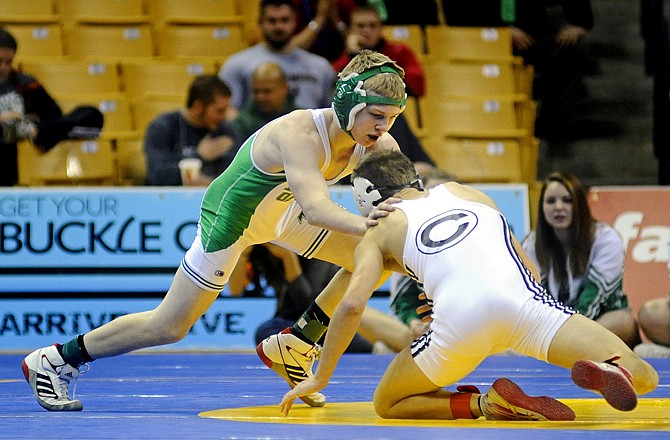 Cole Kemna of Blair Oaks forces Marcus Schmidt of Centralia back to the mat during their Class 1 120-pound championship match last season at Mizzou Arena.