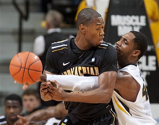 Missouri's Alex Oriakhi, right, knocks the ball away from Appalachian State's Brian Okam, left, during the first half of an NCAA college basketball game, Saturday, Dec. 1, 2012, in Columbia, Mo.