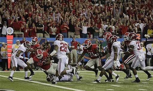 Georgia running back Todd Gurley (3) falls into the end zone for a touchdown against Alabama during the second half of the Southeastern Conference championship NCAA college football game, Saturday, Dec. 1, 2012, in Atlanta.