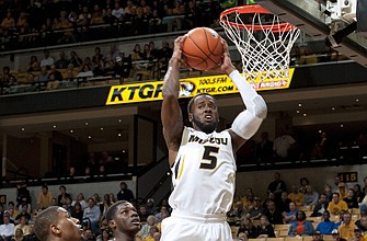 Keion Bell pulls down a rebound during the second half of Tuesday night's game against Southeast Missouri State at Mizzou Arena.