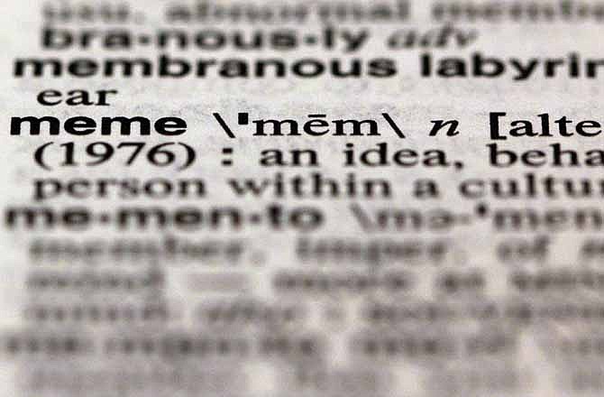 The word meme, from the 11th edition of Merriam-Webster's Collegiate Dictionary, is shown in this photograph, in New York, Wednesday, Dec. 5, 2012. Thanks to the election, socialism and capitalism are forever wed as Merriam-Webster's most looked-up words of 2012. Democracy, globalization, marriage, malarkey and bigot also made the Top 10.