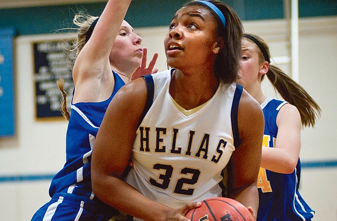 Helias' Bre Zanders prepares for a layup during Thursday's game against Fatima at Rackers Fieldhouse.