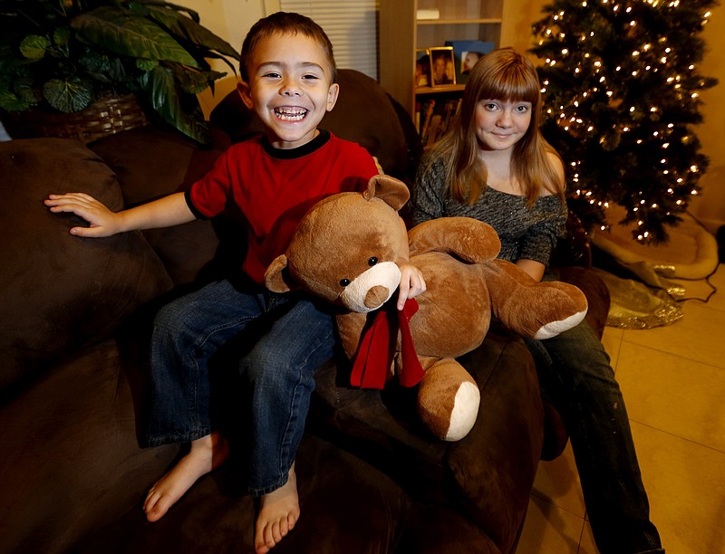 McKenna Pope, 13, right, of Garfield, N.J., started a petition demanding the toy company Hasbro make its Easy-Bake Oven more boy friendly for her brother Gavyn Boscio, 4.